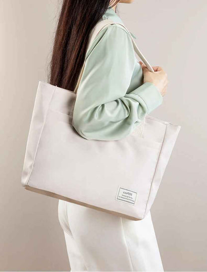 Sac ordinateur femme porté  style urbain et élégant